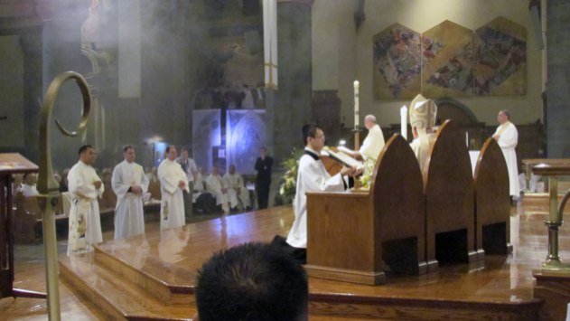 With incense in the air, Rev. Mr. Rene I. Constanza, CSP (left), Rev. Mr. Thomas C. Gibbons, CSP, and Rev. Mr. Richard R. Andre, CSP (right) are presented to Bishop Walter Hurley of Grand Rapids, Mich., as candidates for priestly ordination during the May 19 ordination liturgy. (Photo: Stefani Manowski)